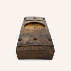 Wooden stave bottle display with a circular cutout on a white background