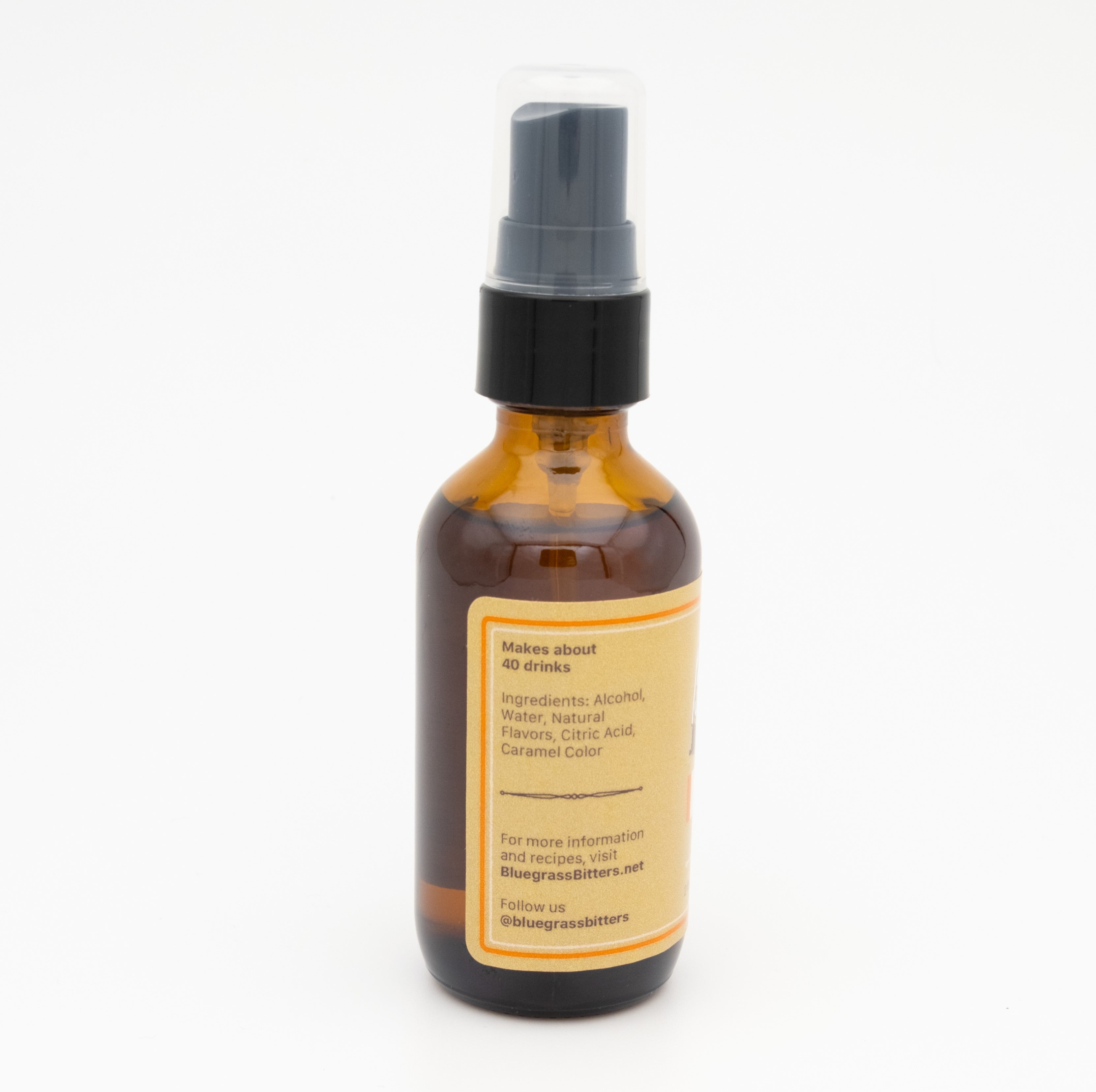 Amber glass bottle with a black spray nozzle on a white background