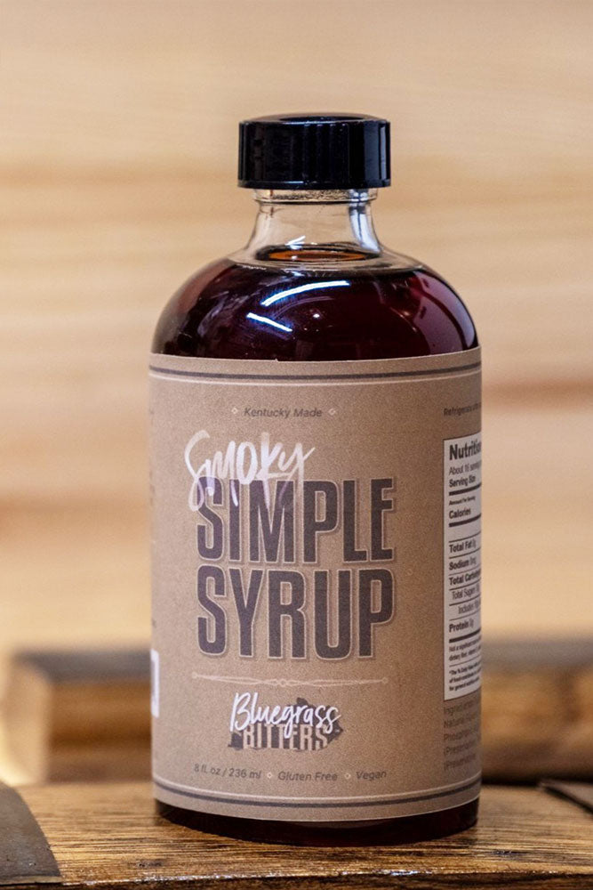 A bottle of Bluegrass Bitters Smoky Simple Syrup.